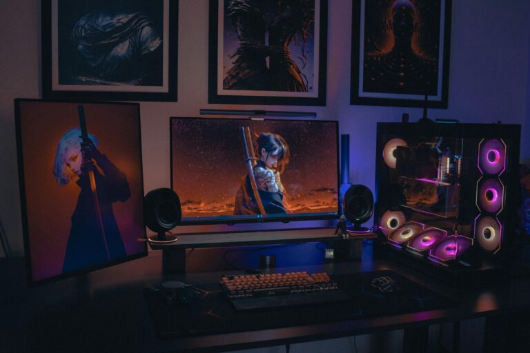 Colorful gaming setup featuring RGB-lit PC and anime artwork. Ideal for tech enthusiasts.